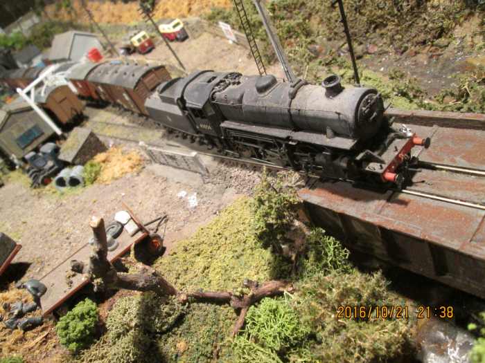 Many Ivatt Class 4 2-6-0 engines were built at Darlington during and after WWII, 43054 allocated to 51A Darlington was one. Here she takes an Up branch goods across the bridge past Ayton Row's depot