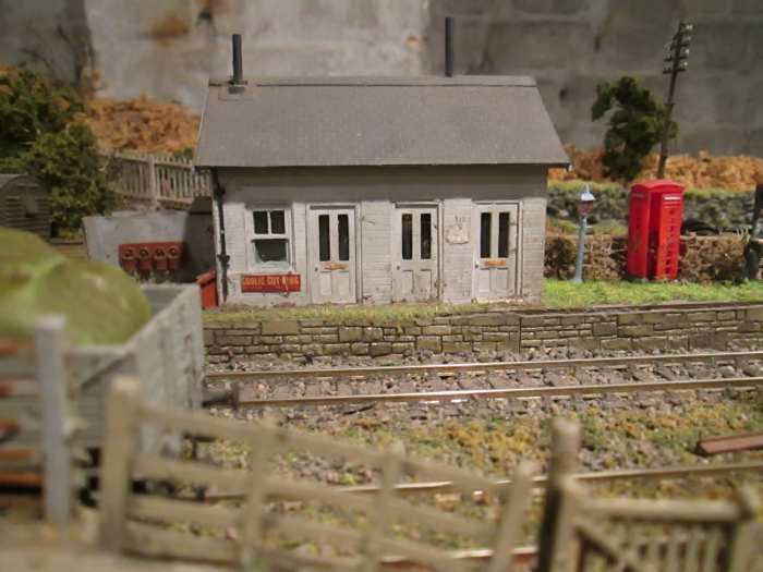 Short version of an archetypal lap-board North Eastern platform building with booking office, waiting room and ladies room - outside gents on the left, where the fire buckets are ranged along the wall