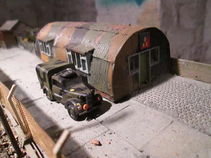 Royal Engineers' store: One of the two Nissen huts within the camp next door to the station; tarpaulined army vehicle passing (Oxford 4mm scale model).