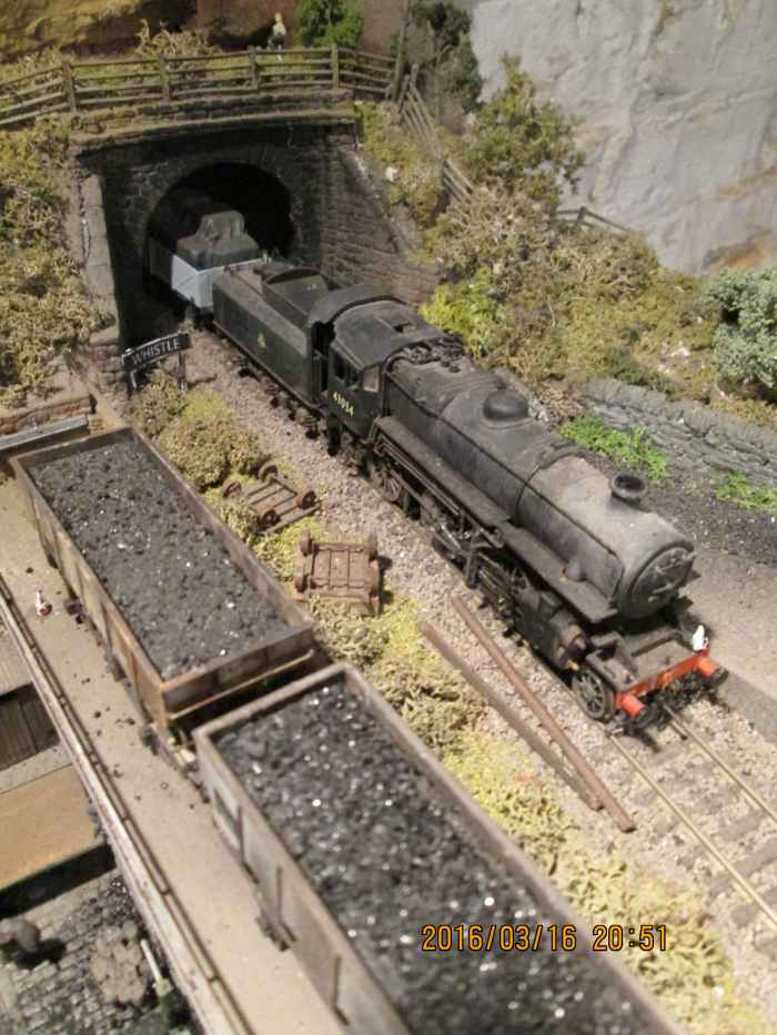(Seen before the addition of the shed for the Bachmann Branchline Wickham Gangers' Trolley):With an unfitted branch goods working 43054 emerges from the tunnel adjacent to Thoraldby's coal depot
