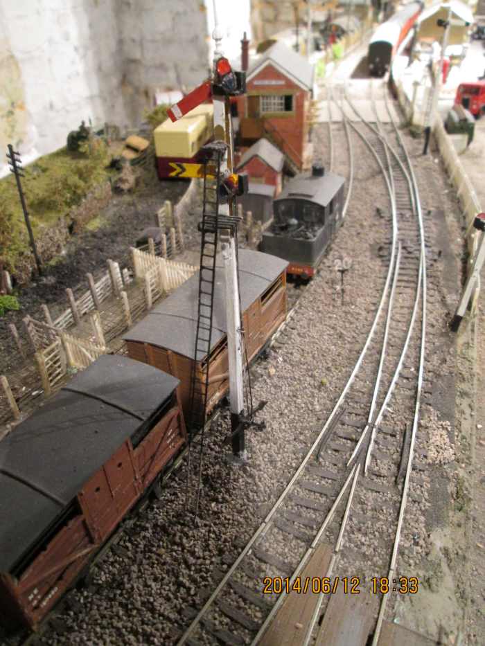 The path is set for the next 'up' working. Here we are looking past the 'up' home at 'off'', down at the livestock dock. Through running line centre, coal depot siding on the right