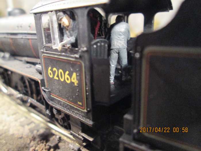 Here's the Model-U driver of Stockton-on-Tees K1 62064 looking back at the photographer during a signal check near Thoraldby. In the lull, fireman tops up the coal in the firebox