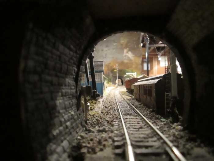Looking through the road bridge towards Ayton Row station past Ayton Lane (Station) SB on the left