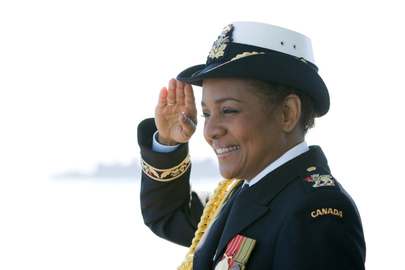 Governor General and Commander-in-Chief of the Canadian Forces Michalle Jean salutes on the HMCS Algonquin destroyer in Victoria, B.C. on Saturday during an international fleet review celebrating 100 years of the Navy in Canada, June 2010