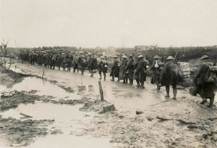 Just another rainy day on the way to the trenches, where they learned that the German blokes had been trained the same way as them.