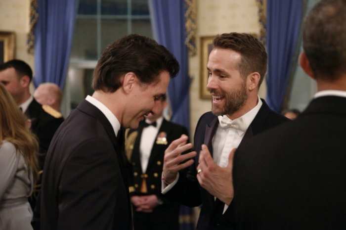 Ryan Reynolds speaks to Canadian Prime Minister Justin Trudeau during the state dinner at the White House