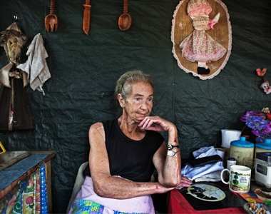 Mara Udwesthuizen, 64, sits outside her tent home at a squatter camp for poor White south African at Coronation Park in Krugersdorp