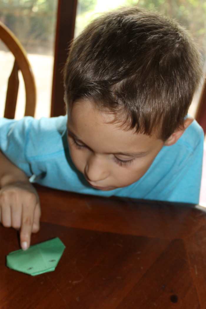 You can also make the origami frog using green copy paper (what can be used in printers). We learned the hard way that using construction paper makes a "lethargic" frog that does not jump as well.