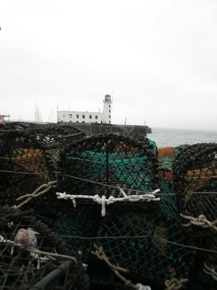 A view of the lighthouse from across some of the crab and lobster traps on the Fish Quay