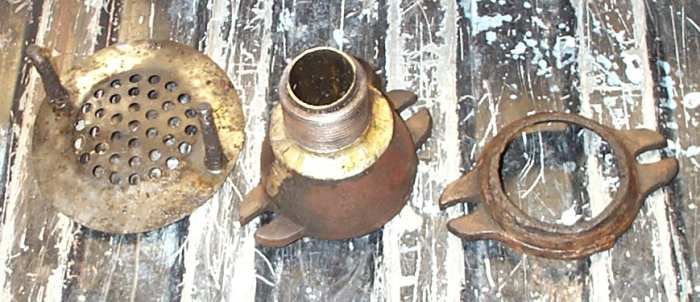 The drain parts from my father's old sink. The lead pipe would have been belled to fit with these parts. The pipe on this sink had been instead bronzed to the bell.