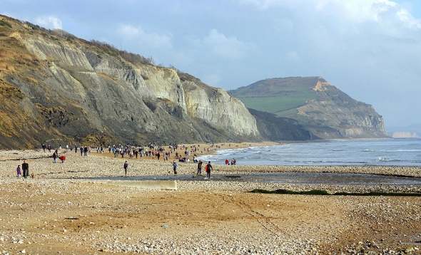The Jurassic Coast at Charmouth, Dorset, England where Mary Anning discovered large reptiles in the shales of Black Ven; Golden Cap in the near distance