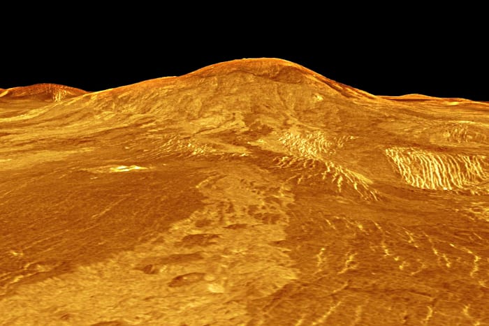 This image features Sif Mons, a 2 km (1.2 mile) high volcano with a diameter of 300 km (180 miles). The lava flow in the foreground extends for hundreds of kilometres