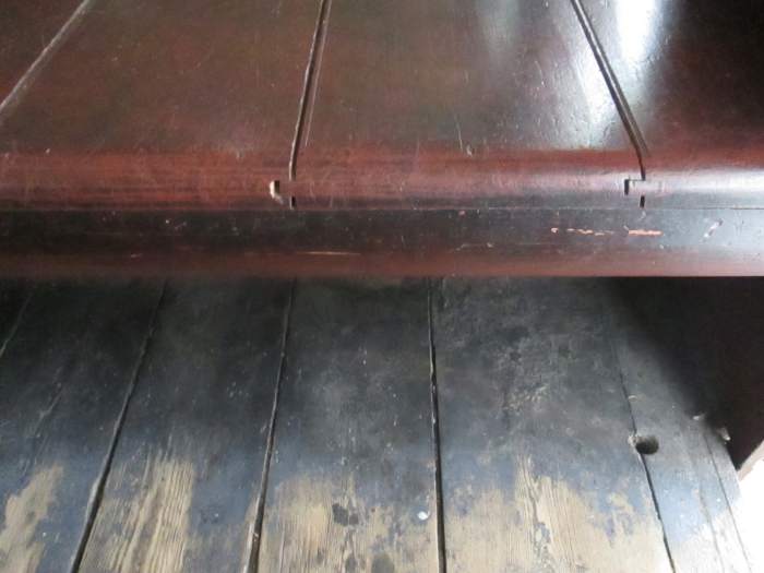 Seating and flooring. Varnished hardwood benching, untreated wood flooring - neat dove-tailing on the bench seat though, don't you think?
