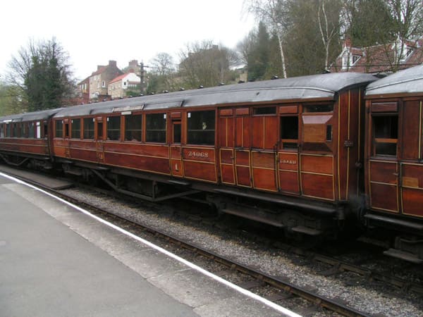 Rake of Gresley side-corridor stock in teak with gold sized lettering and numbering on Severn Valley Railway (SVR)