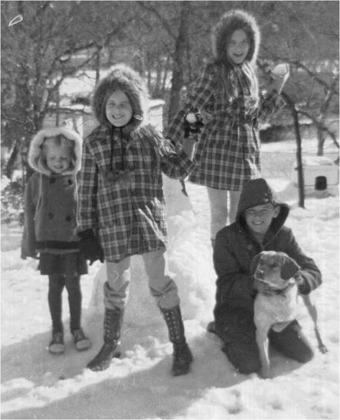 Freak snow day in the South. My siblings and I and Brownie. I am the oldest one behind my brother. Look at those outfits LOL.