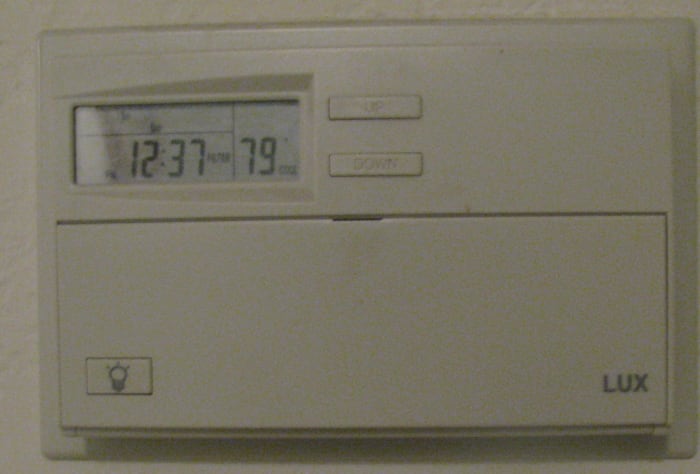 Smart grids would link programmable thermostats like this in private homes to centralized control centers to regulate power usage.