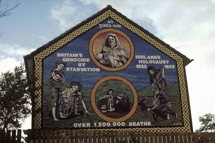 Ireland's Holocaust mural on the Ballymurphy Road, Belfast. "An Gorta Mór, Britain's Genocide by Starvation, Ireland's Holocaust 1845–1849."