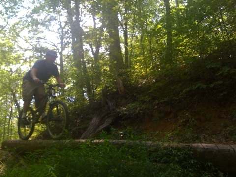This is me riding one of the log bridge trail features at Bent Creek. Bent Creek is my favorite mountain biking destination.