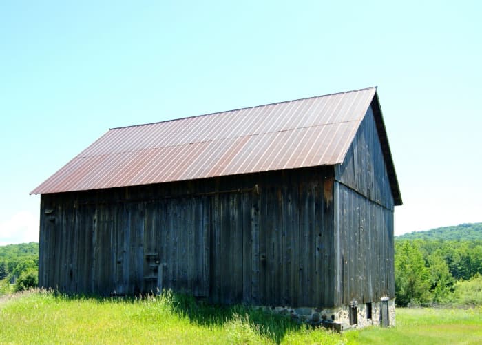 The ramp to the raised middle level combined with a high stone foundation provided a lower level where livestock could be kept.