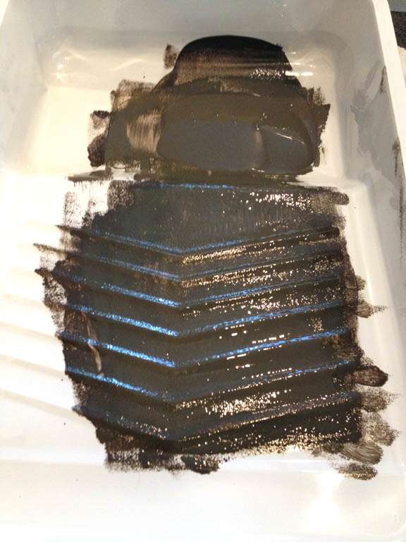 I only poured a small amount of paint into my paint tray. Working with a small amount of paint helps keep your roll from getting too much paint on it.