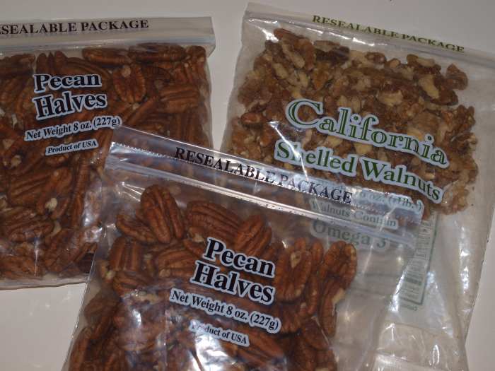 Pecans and walnuts in their original packaging. The bags have been opened so they should be frozen promptly.