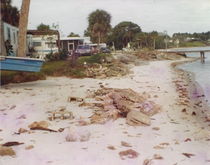 You can see how close to the water my John boat was. That is why I rigged it atop of a three roller platform, so the water could roll under it in the storms and not beat it to a pulp against the rocky shoreline.
