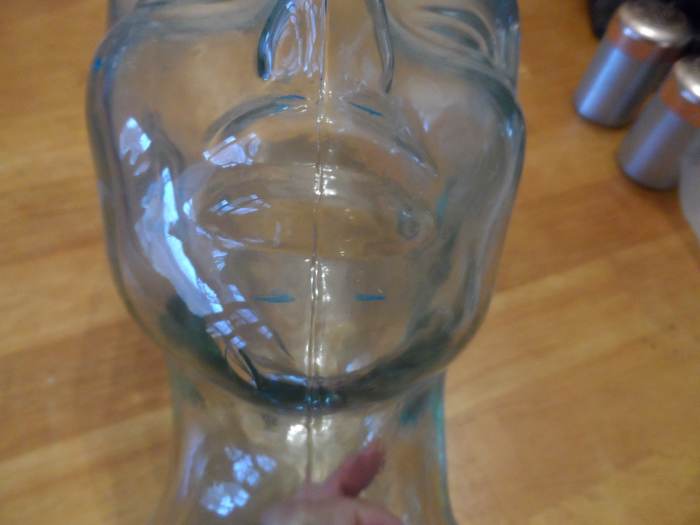 Glass face bust displaying areas wires are attached to a patient's head during a sleep study.