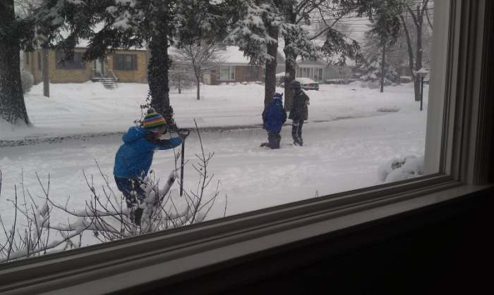 The snow brings colder temperature. No School due to snow butstill warm enough for the kids to play outside