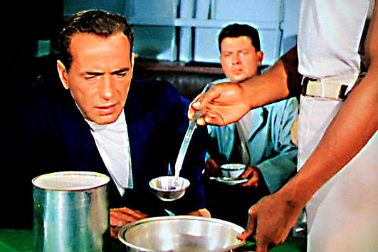 The 'Affair of the Missing Fruit'. Captain Queeg watches closely as his suspicions are confirmed - some strawberries were stolen