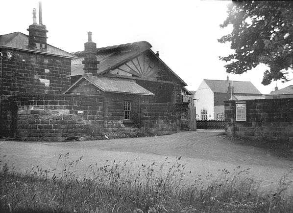 A derelict Guisborough Station after closure in the spring of 1964 - glass broken at canopy end near passenger entrance