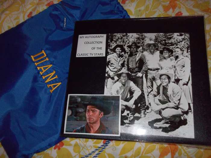 This is the cover of the Scrapbook I keep my autograph pictures in. Notice the cinch sack with my name on it, it fits perfectly over the scrapbook for extra protection.