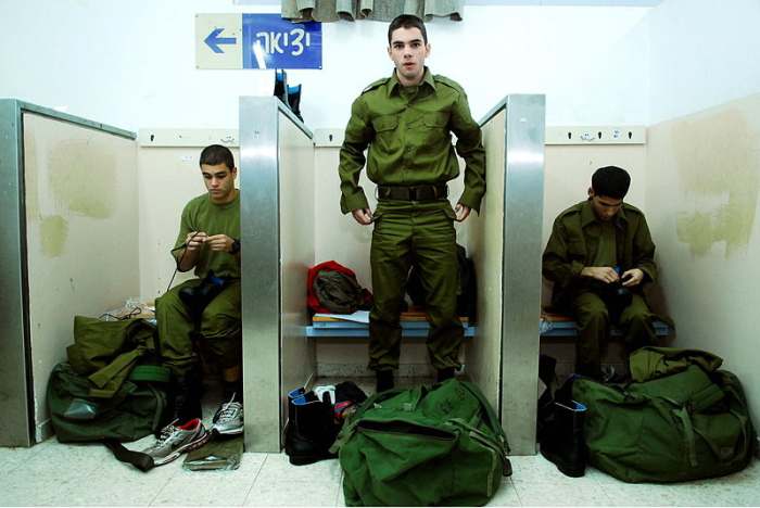 Roman conscripts trying on uniforms for the first time. At the completion of two years service, these civilians would become citizens.
