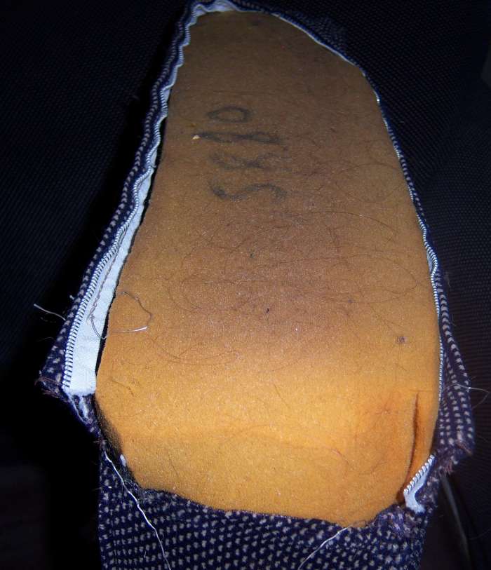 As you can see, this cushion cover is in desperate need of repair. The foam could probably use a lint brush, too.