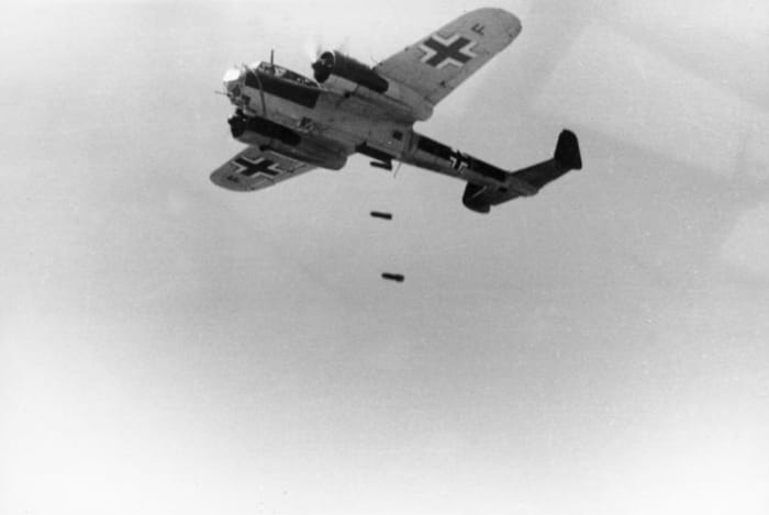 A Dornier DO 17 Z airplane drops bombs. The plane belonged to the 3rd Luftwaffe "Polen" and the war reporter company (KBK) of the 3rd Luftwaffe.