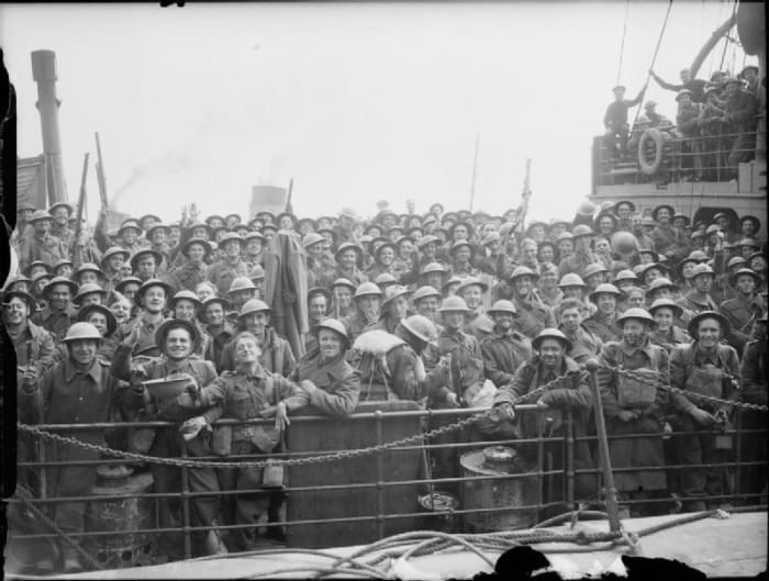 Cheerful British troops crowd the deck of a Royal Navy destroyer at Dover, 31 May 1940.