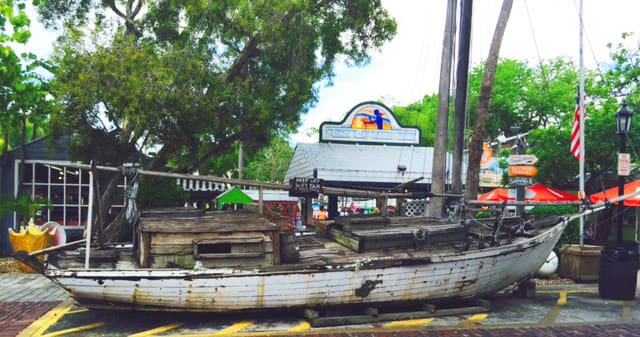 This old boat is one of the many interesting sights you can find in the Old Town part of Key West. We were walking down Duval St. and hearing the famous Roosters, we took a turn and walked by this old sailboat.