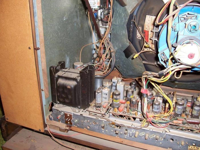 Another look at the insides of the Iberia model, Dimensions 46 inches long, and 28 3/4 high both have a 295 square inch color picture tube, and fine tuning.
