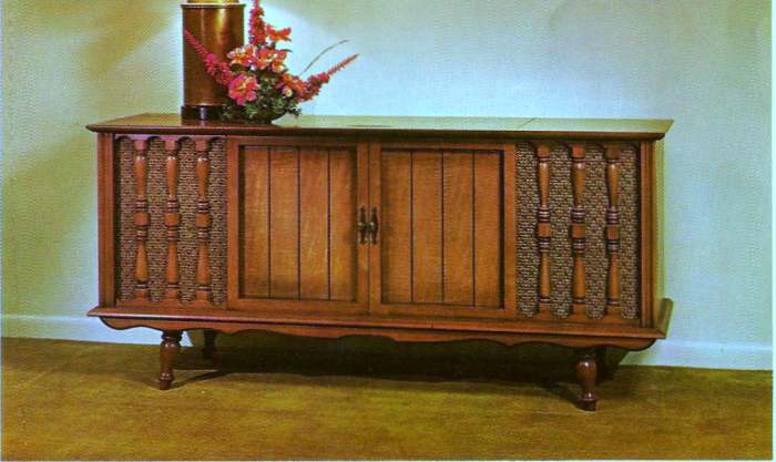 The Springfield, Model 40M789, Genuine maple veneer and selected wood solids, Dimensions are 60 inches longe 28 /1/4 high, with a Curtis Mathes custom stereo sound system and four speakers. Retail Price $229.95