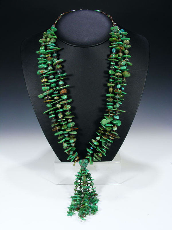 Turquoise necklace - large turquoise mixed with brown heishi and a jocla hangling from center