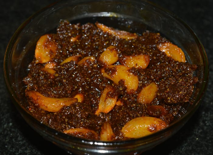 Store garlic pickle in a glass bowl or jar. Consume it after a week. By this time, the pickle sets properly. No need to keep it in the refrigerator.