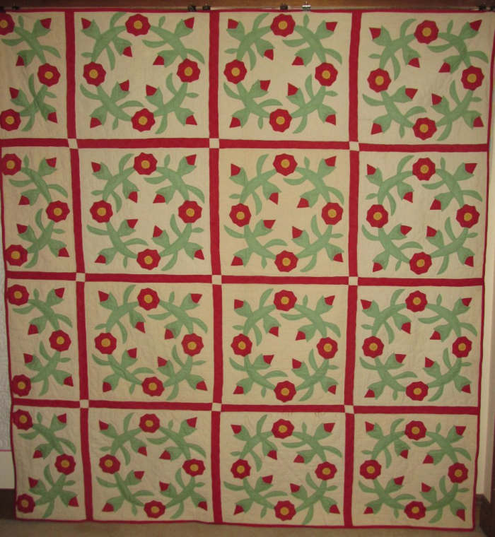 This antique quilt is a Rose Wreath hand appliqued quilt by Jeffie Beaver (Mrs. A. W. Smith 1894-1985).