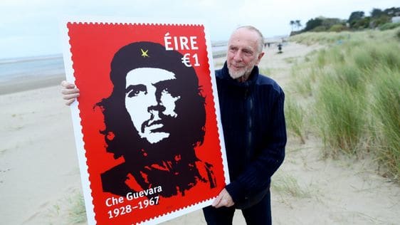 Irish artist Jim Fitzpatrick creator of the iconic image of Che with large copy of Ireland's stamp commemorating the Argentinian-Irish revolutionary