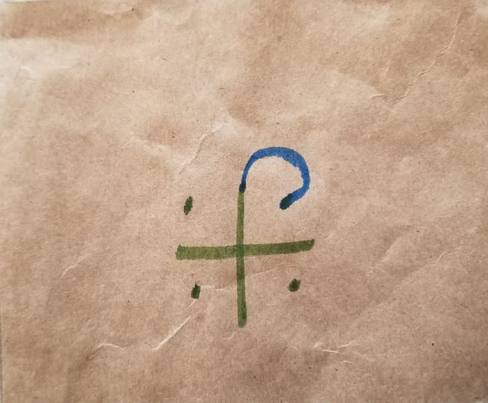 Step 2: Create the center of the path by drawing an arch from the top of the cross to the first corner dot.