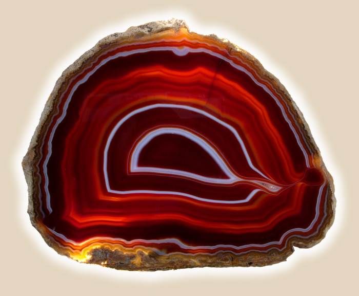This may or may not be Nanhong Agate. The materials and sculptures are so rare, that it's hard to find accurate pictures. However, Nanhong Agate sculptures look similar to this type of agate.