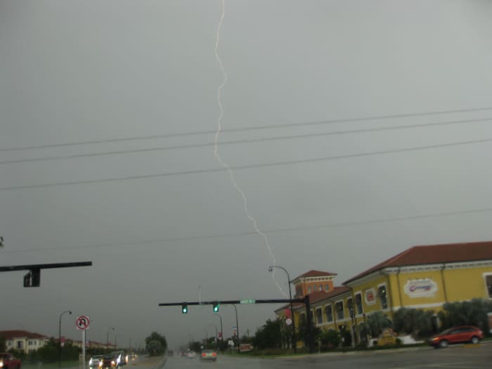 I took this picture during the storm I describe here - no, not while driving; I was at a red light! The picture really doesn't do it justice at all...but I was proud of myself for actually catching one with the camera!