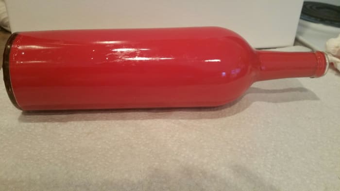 If there are gaps in your paint, lay your bottle down with the unpainted area on your surface and let the paint run to that point until it is covered.