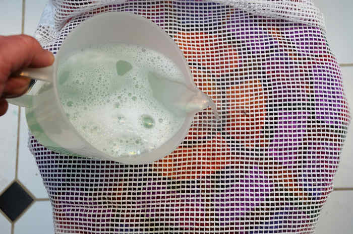 Cover the fibers and wet with hot soapy water. Rub well with fingers or sand with an electric sander.