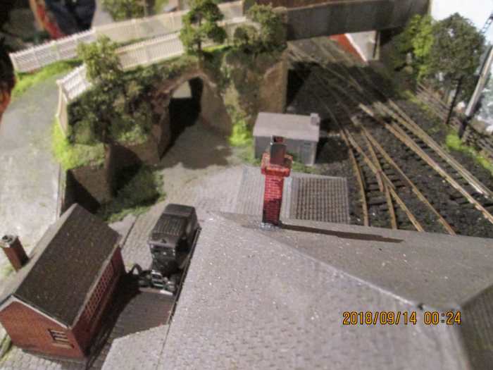 Bird's eye view over goods shed shows cab's on its wayr. Note vegetation and picket fencing added. Still some to add on the ramps, as well as a loading gauge and platform water crane. Soon be complete, then it's hi-ho, hi-ho to add the fiddleyard