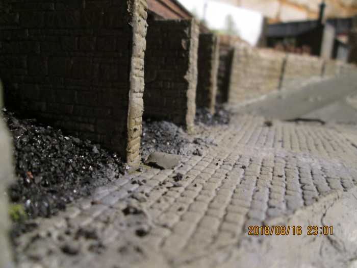 The road surfaces have been painted, as has some of the other scenery. This is the view along the coal cells looking uphill towards the underpass
