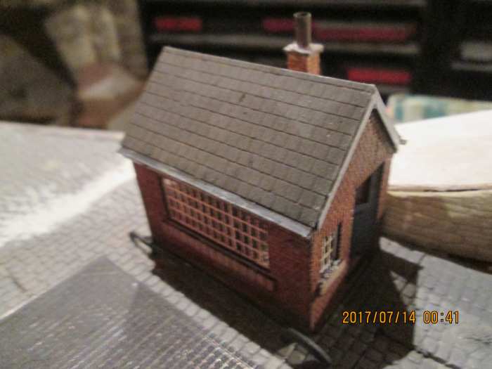 The front view of the modified Osborn's Models weigh office with steel barrier to stop vehicles hitting the building. Etched brass weighbridge and white metal barrier from Scale Link